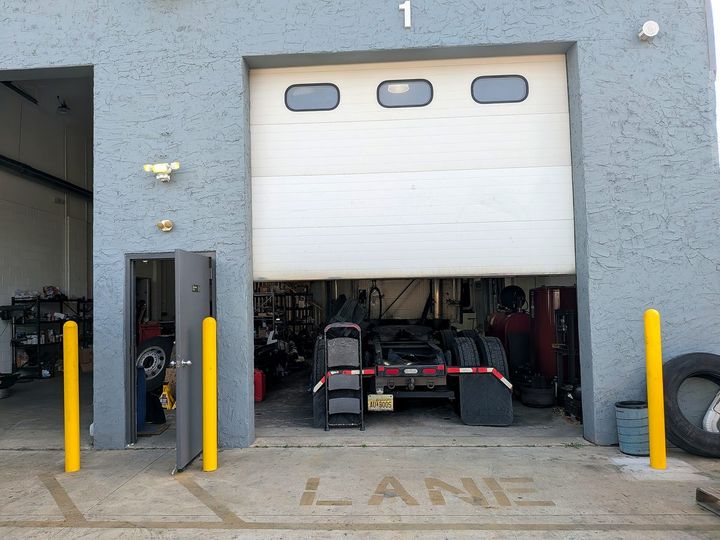 Truck chassis in an active service bay